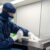 a person wearing a mask and gloves
