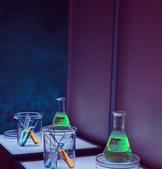 clear glass bottles on white table