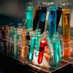 a bunch of test tubes filled with different colored liquids